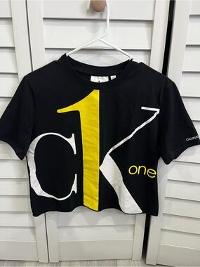 Calvin Klein black Tee shirt with Yellow & White Graphic
